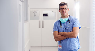 Surgeon in hospital corridor