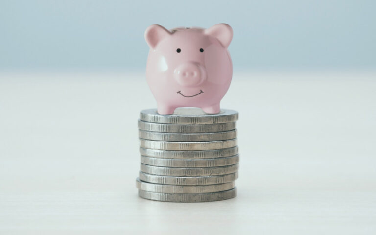 Piggy bank on coins