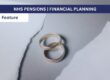 Wedding rings in between a sheet of torn paper
