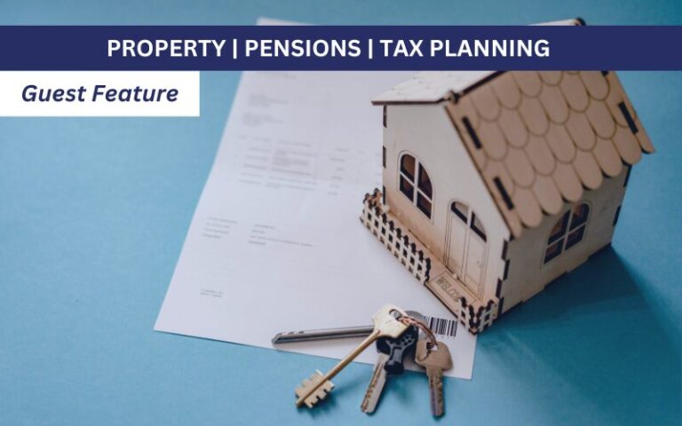 Model property with keys on a table with paperwork