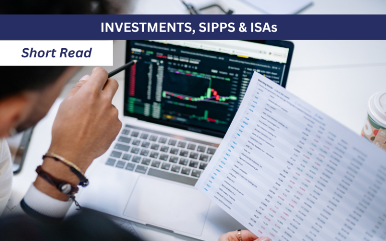 Stock market trends on laptop comparing to data on a sheet of paper