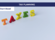 "Taxes" on colourful wooden letters